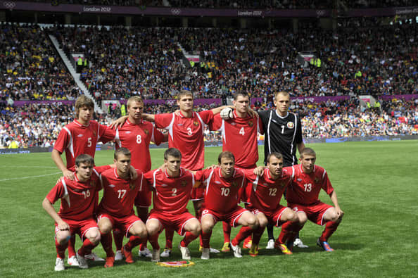 Belarus's starting lineup poses ahead of its match against Brazil at Old Trafford in Manchester, England.