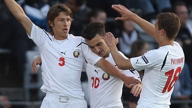 Dzmitry Baga (5) celebrates with Aliaksandr Perepechko (10) and Denis Polyakov (18) after Baga scored a goal against hosts Denmark in Aarhus.