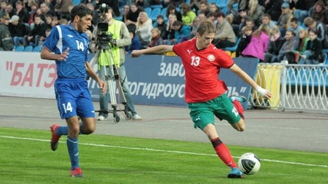 Belarus's Paŭlo Nekhaychik (14) is in action against Bakhtiyar Soltanov and Azerbaijan in a qualifying match in Minsk, Belarus. Nekhaychik scored the only goal of the match to send Belarus to the UEFA U-21 playoffs