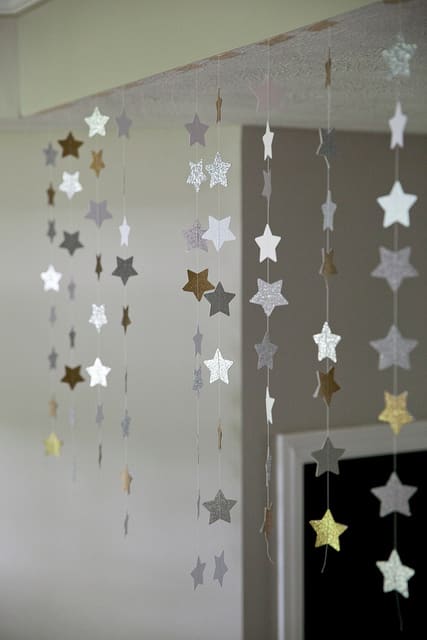 Hanging star decorations - string, star paper cutouts and some tape are all that's needed to make these eye catching decorations.