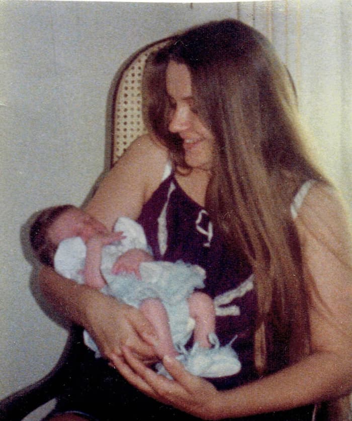 The "After" Photo of my first born ...my daughter. My hormones were working overtime during natural childbirth as my hair turned a bit darker overnight!