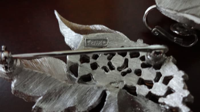 The style of the mark with the crown above the T and a copyright symbol indicates these pieces were produced after 1955.