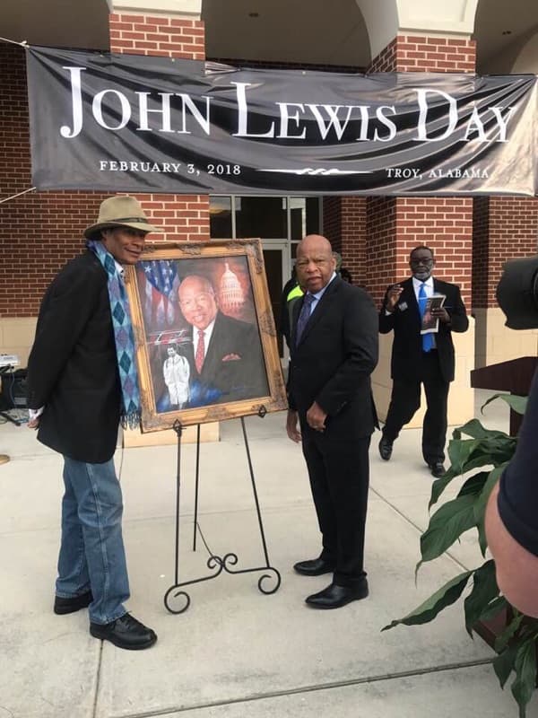 Dr. Ron presents Congressman and Civil Rights Leader, John Lewis, with a portrait for "John Lewis Day" in Troy, Alabama