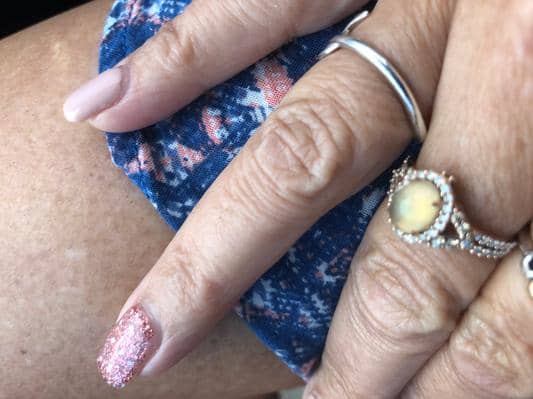 The image that the other disgruntled buyer added on the Jared website to show how the opal was dull and lackluster. It's a different style, but the same Neopolitan Opal from LeVian.