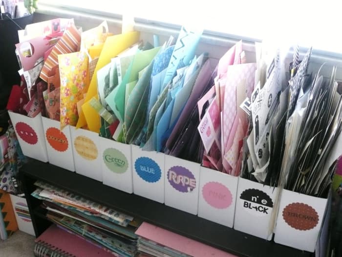 Magazine holders that are color coded are one way to hold your paper scraps- the great feature of this system is that you can see what you have and where it is.