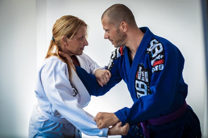 Jiu Jitsu primarily relies on grabbing and locking up or choking an opponent, in addition to various throws.