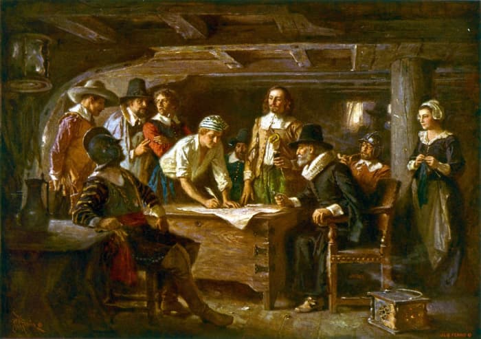 The painting “Mayflower Compact” by Jean Ferris depicts passengers of the Mayflower signing the Mayflower Compact