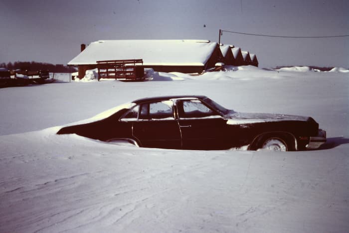 Dad ALMOST made it home before he had to bail out in a farmer's field. We trekked up the street the next day to find his old Buick in the drifts.