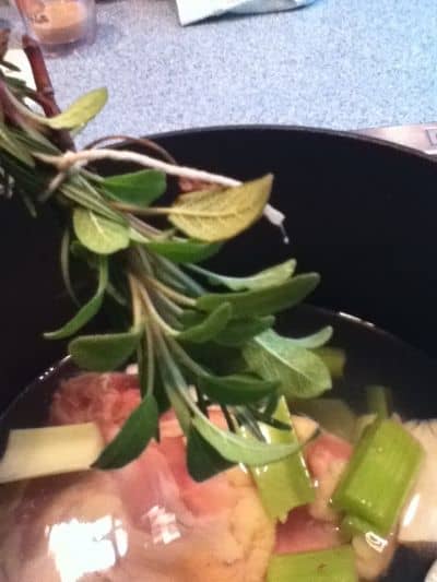 Herbs make a delicious flavoring for any soups - This bundle of thyme and rosemary is about to embellish a pot of chicken soup
