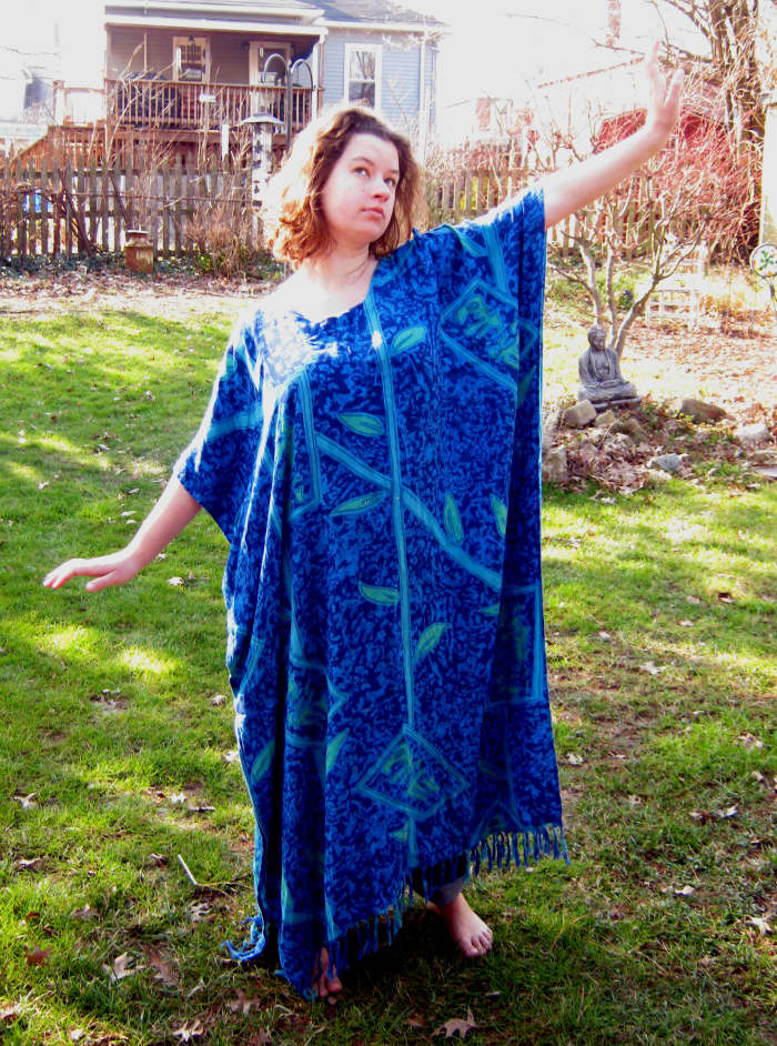 This lovely young woman shows how the Western style kaftan is made of a large rectangular piece of fabric