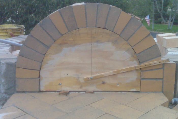 See also the "compass" made here with a stick to keep the curve accurate. Centering should remain in place for at least seven days after construction of the arch and longer in cold weather - Brick Institute of America.