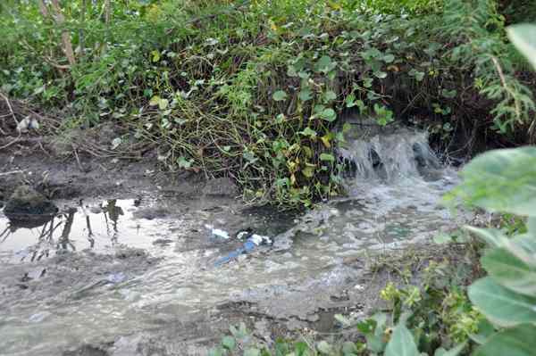 Just below the Durga temple is an opening. This constantly dumps the drain waters into the Chitravati.