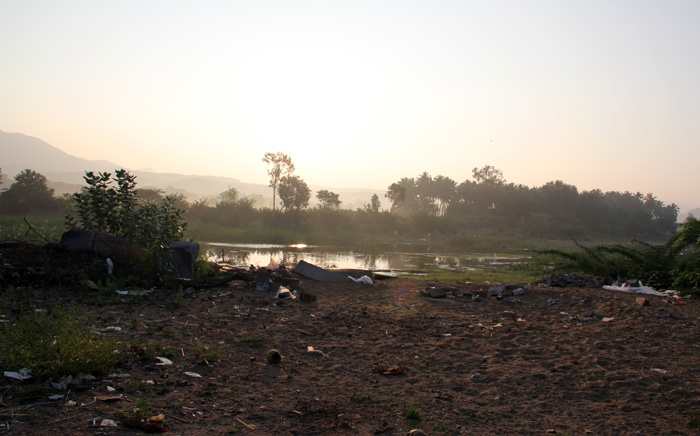 The break of dawn is an awesome sight at river Chitravati. The moment the foreground is seen, it is a painful and dirty sight.