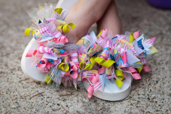 Tie pieces of ribbon onto a pair of flip flops. This project is great for all those pieces of scrap ribbon.