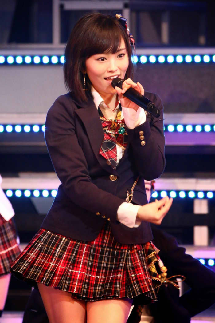 NMB48's Sayaka Yamamoto is shown here on stage and she was chosen as center for the theme song that will be discussed.