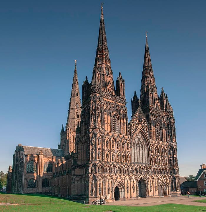A picture of the west face of Lichfield Cathedral showcasing its three iconic spires. Source: Bs0u10e01 via Wikimedia Commons