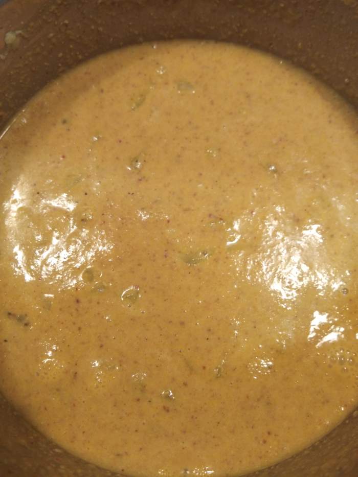 Add this ground coconut paste to cooked bottle gourd-dal mixture. Add salt, mix properly and boil in low flame for 2-3 minutes. Add water if required.