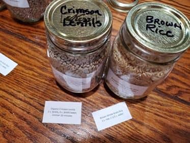 In addition to the label on front, I also put on top so I can see what is in the jar whether on a shelf or packed back into the canning jar box. I forgot to add a date and had to go back and add to lid and label.