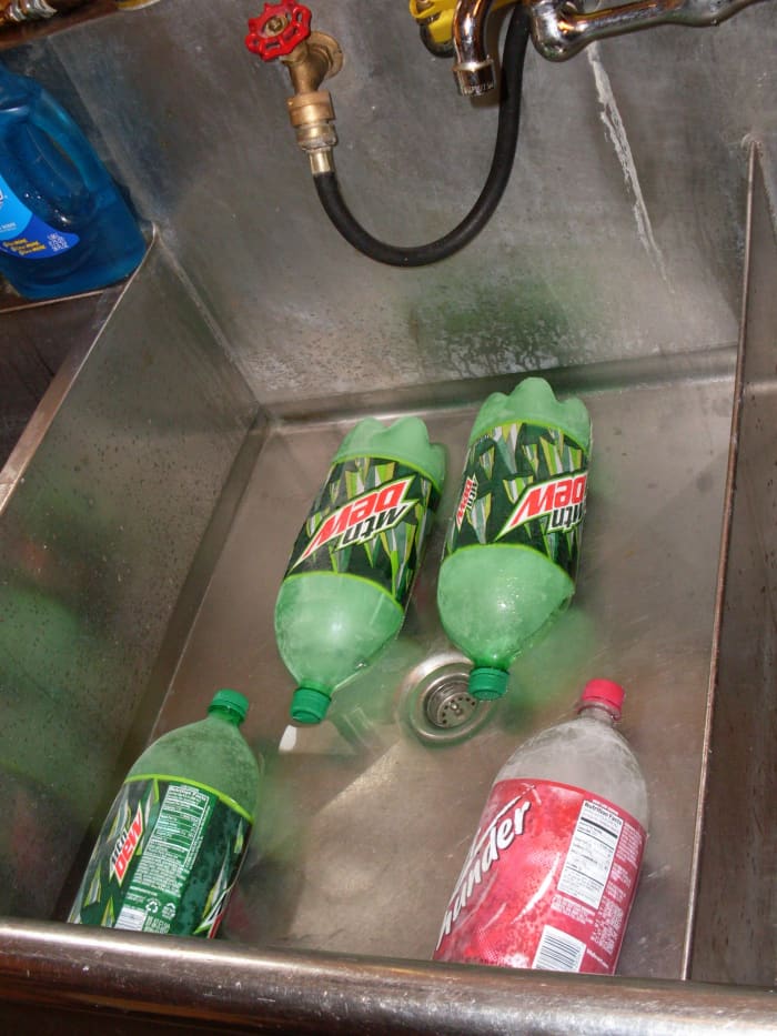 Now is a good time to put some of the bottles of ice in your chicken cleaning water. First run the coldest water you can.