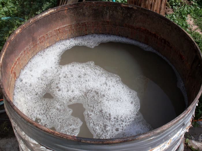 A bit of dish detergent makes the water penetrate better, and so helps the scalding and plucking. Have a thermometer clipped to the side of the scalder.