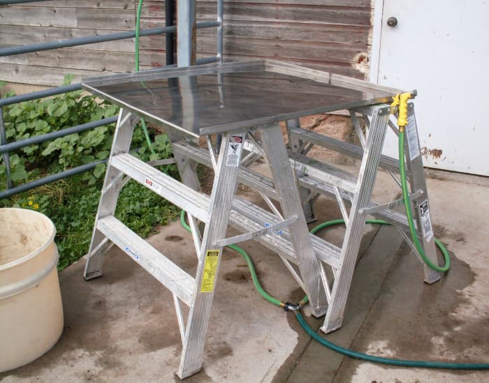 Our work table, a stainless steel sheet with "lips" on 3 sides. We also had 2 garden hoses with spray nozzles.