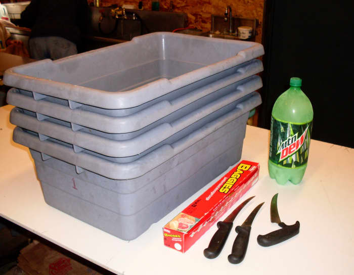 At least 3 tubs for hauling finished chickens. Knives designed for meat cutting. Freezer bags - we needed 2 gallon-size; if your birds are small or skinny, recycled bread bags may work. Frozen bottles of water are great for rinse water.