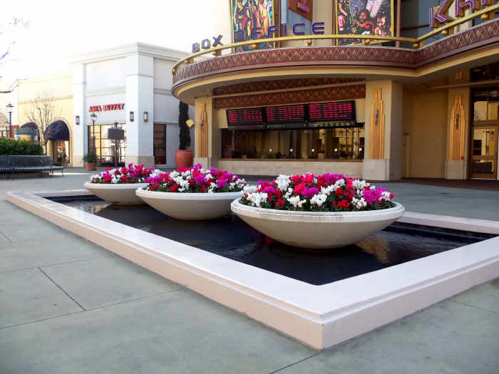 - Beautiful floral arrangements gently forged into colorful displays such as the one depicted above float effortlessly and are gently massaged with precise artistic intent into the period scenery just outside the "Chicago Style" Krikorian Theatre -