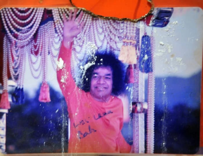 The photo which Swami signed...which later fell and got burnt...(note that no part of Him has been touched) which had vibhuti appearing on it in March 2012