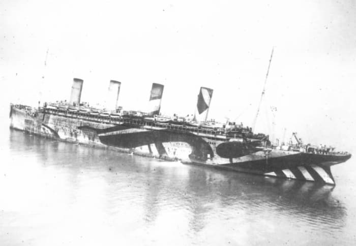 Olympic during WWI as a troop carrier. Note the 'dazzle' paint. Titanic would have regaled a similar design.