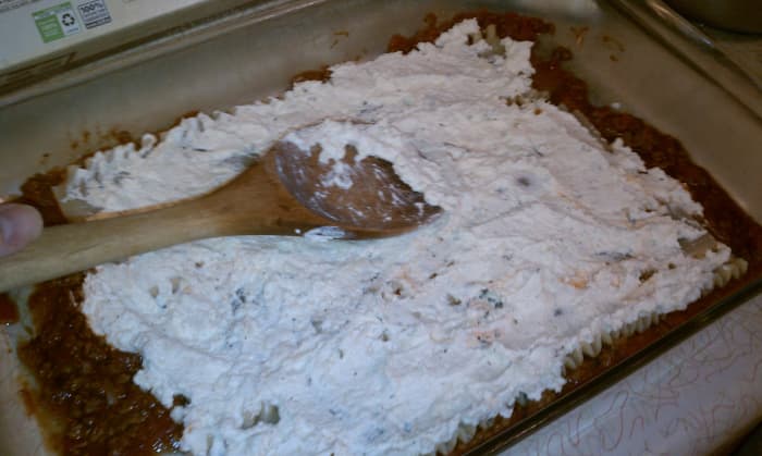 Spreading the cheese mixture isn't easy! I work it lengthwise along the noodles, then across.
