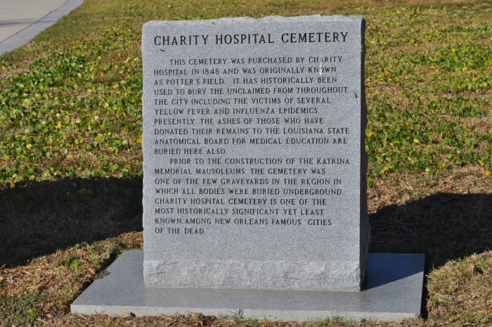 The marker to the dead here. The last line reads "Charity Hospital Cemetery is one of the most historically significant yet least known among New Orleans famous "Cities of the Dead.""