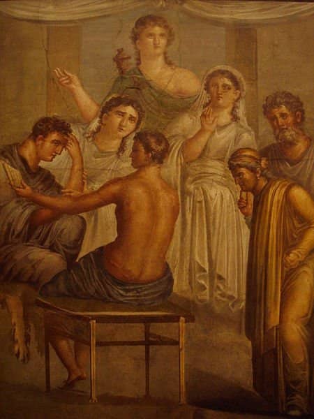 Roman fresco from The House of the Tragic Poet, Pompeii. Alcestis and Admetus receive a message from an oracle that Admetus' life can be saved if someone offers themselves as a substitute. Apollo stands in the background.