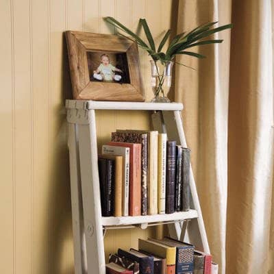 An old stepladder (you may have one lying around in your garage or basement) can be easily converted into a great little bookcase!