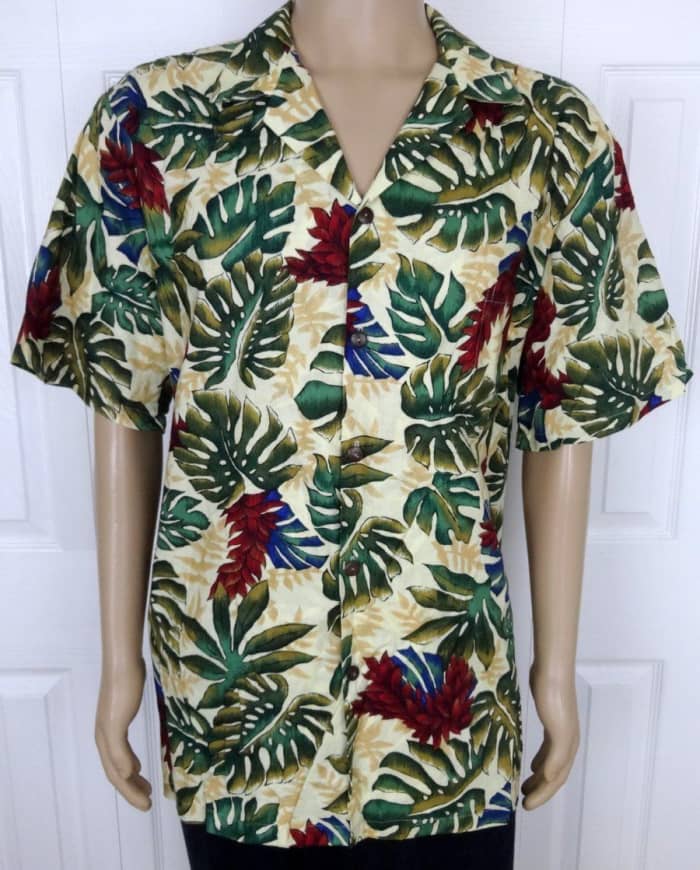Hillo Hattie men's beige short sleeve floral casual Hawaiian shirt, made in Hawaii from imported cotton blend fabric. Original Hawaiian design on this wonderfully made shirt, with real coconut shell buttons.