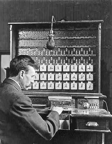 Herman Hollerith demonstrates his tabulating machine in this 1908 photo
