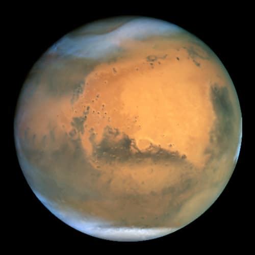 The Planet Mars as seen by the Hubble Space Telescope on June 26, 2001. Objects as small as 10 miles across can be seen.