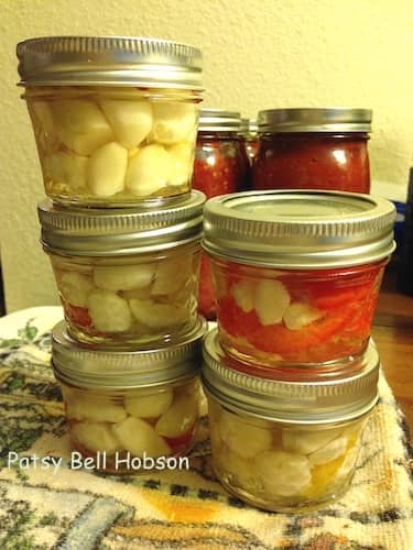 Peeled and pickled, these mild garlic cloves can be substituted for fresh garlic cloves in most recipes.