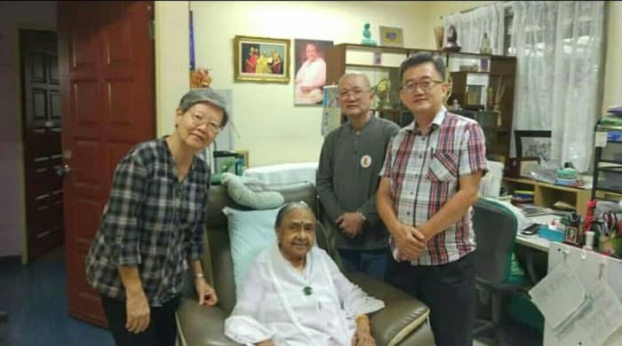Mother Mangalam (seated) Standing left to right; Goodguy's wife, Goodguy, a friend.