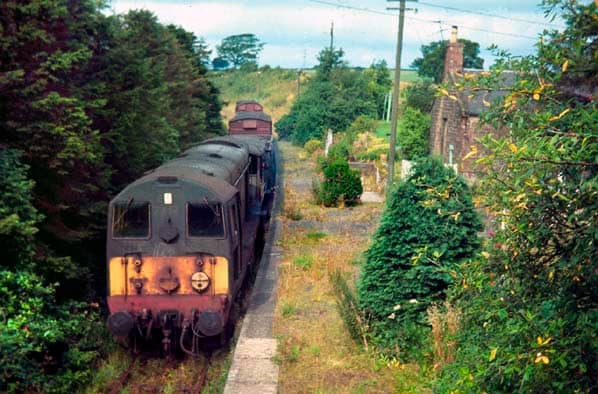 This is Canonbie Station on the former Border Union Railway (not far from Langholm, D&G, on the border) in SW Scotland. The line and the station look inundated by vegetation (Bruce MCartney, 1967)