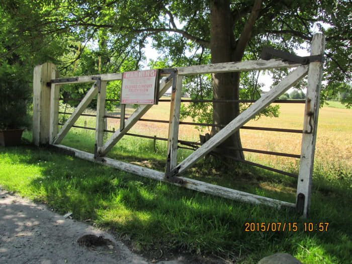 This is detail that finishes off a model - one of a pair of yard gates at the former Masham Station near the market town it served. Steel horizontal bars prevented children from climbing through the gate. Set off against a verdant field boundary
