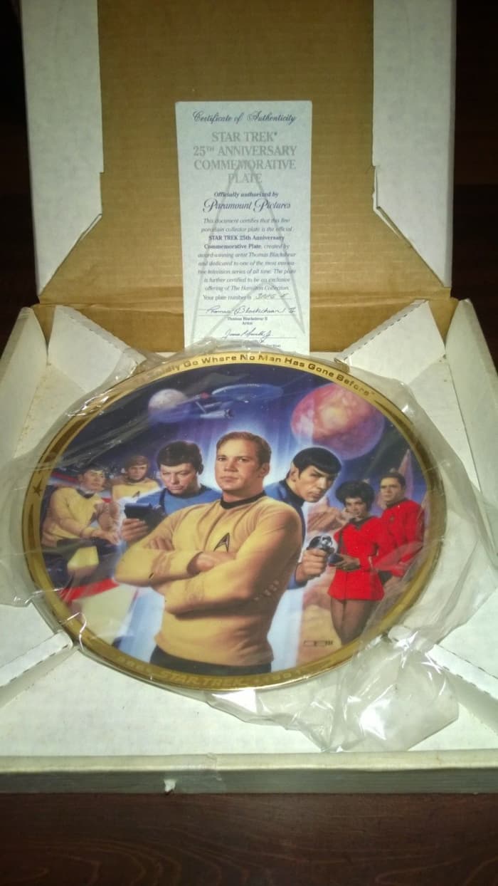This stunning Hamilton Collection Star Trek plate is bordered in 23k gold, and the artwork by Thomas Blackshear II of the crew is very life like and remarkable. This beautiful Star Trek plate came in its original box with certificate of authenticity