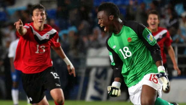 Luca Gasparotto (13) and Qullian Roberts (18) celebrate during a match for Canada in the 2011 FIFA U-17 World Cup. Roberts became the first goalkeeper ever to score in any FIFA 11-a-side competition.