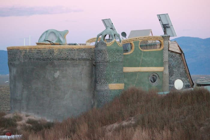 Earthship near Taos, New Mexico. You can see the individual stye of each builder in their Earthship.
