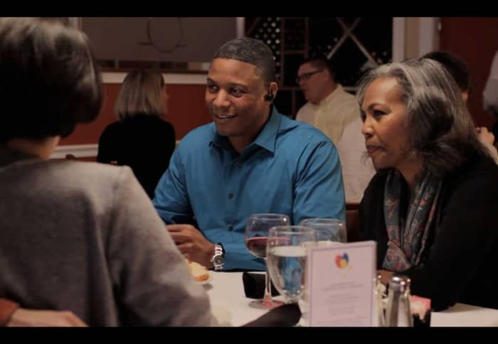 Sound World Solutions CS50+ Personal Sound Amplifier - Right Ear SKU: HC-CS50+R being used in a restaurant setting