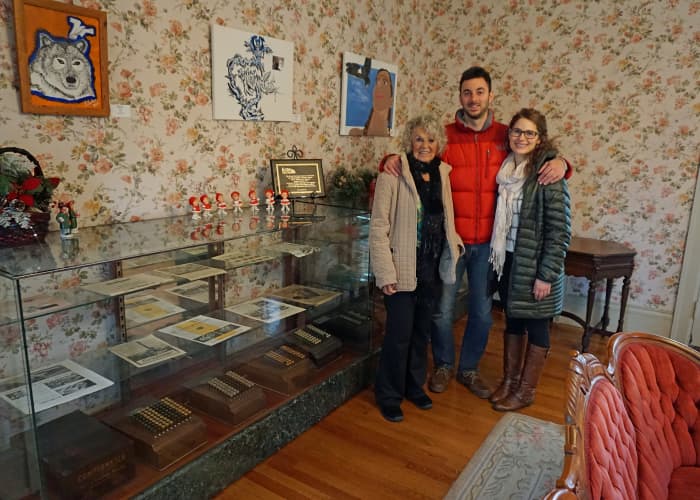 Felt Mansion Display Case of Comptometers. My mother went to Comptometer School in the 40's. (Pictured here with my son and his fiance)