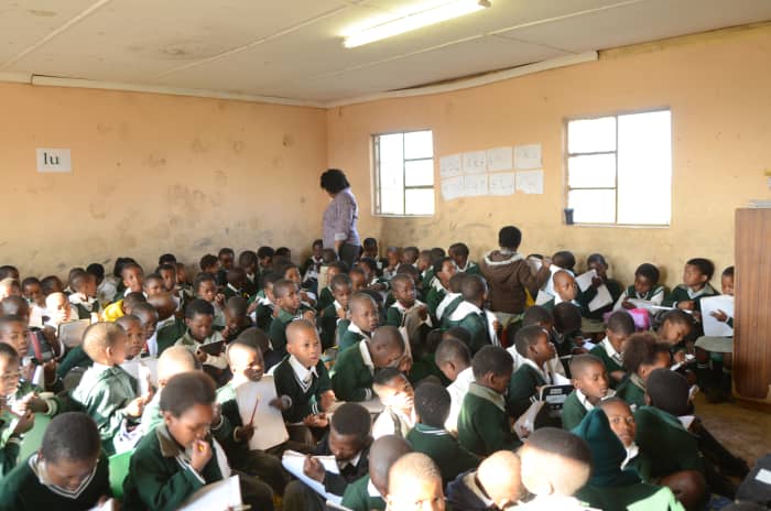 How can our children do any better by the time they reach Matric, when in their lower Primary classes this is the situation they have to deal with, no desk and one teacher for all.. Just like during the Apartheid days, if not worse...