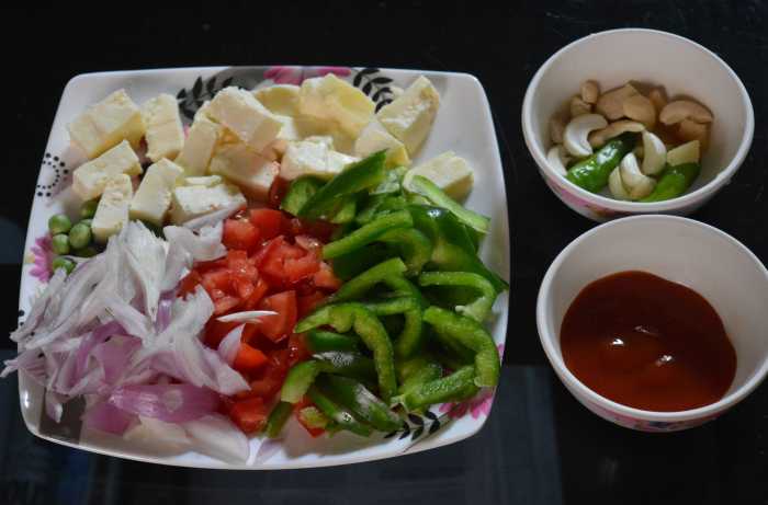 Step one: Keep the ingredients ready. Grind green chilies, ginger, cashew nuts, and garlic to make a smooth paste. Keep aside.