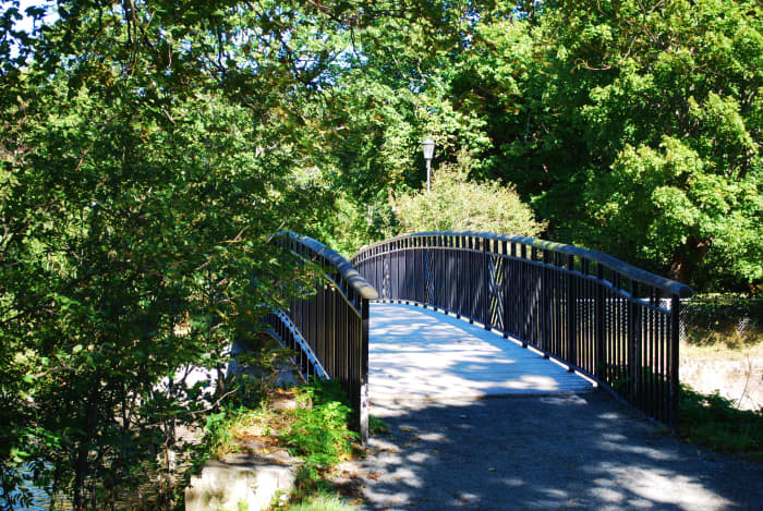 This beautiful rustic bridge crosses the Waterford River at the east end of the Duck Pond.
