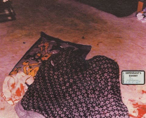 Devon's covered up body with what appears to be a towel next to it. The blood on the towel was Darlie's, and no water was found on the towel.