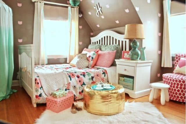 An unexpected color combination with poised taupe walls combined with pink and turquoise soft furnishings works well in this fun room.